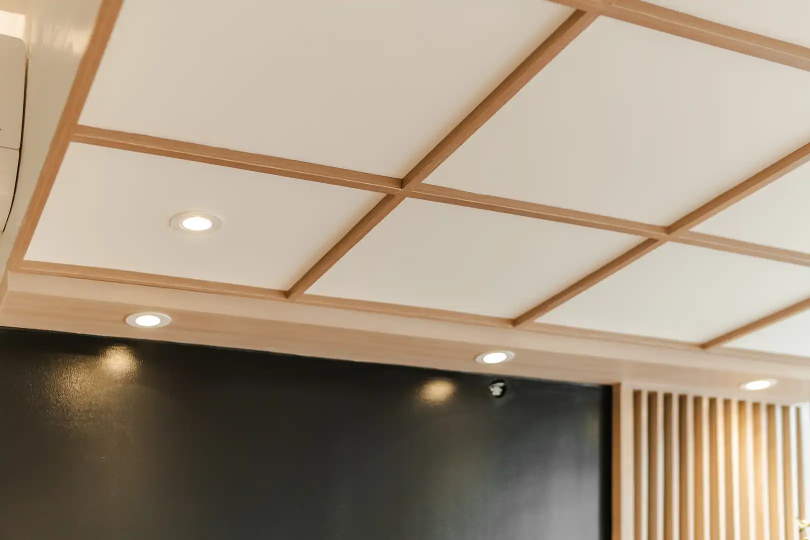 Bright modern bedroom with city view and desk