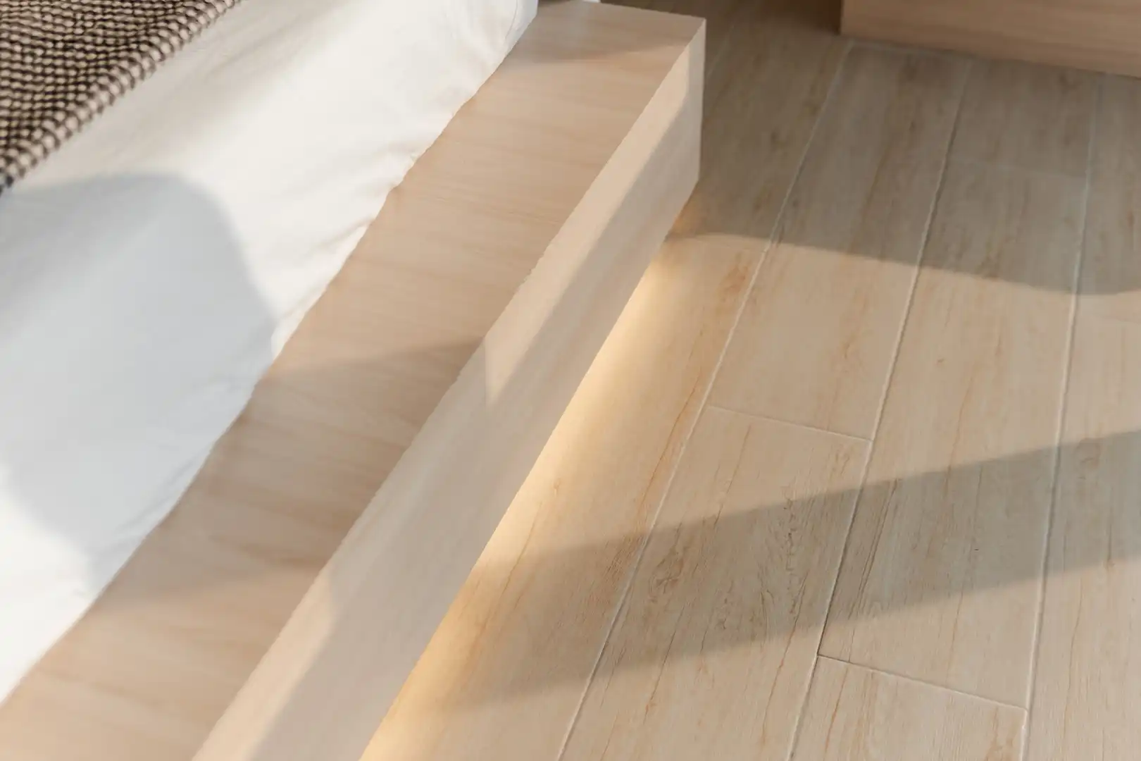 Bright dining area with wooden furniture and cherry blossom centerpiece