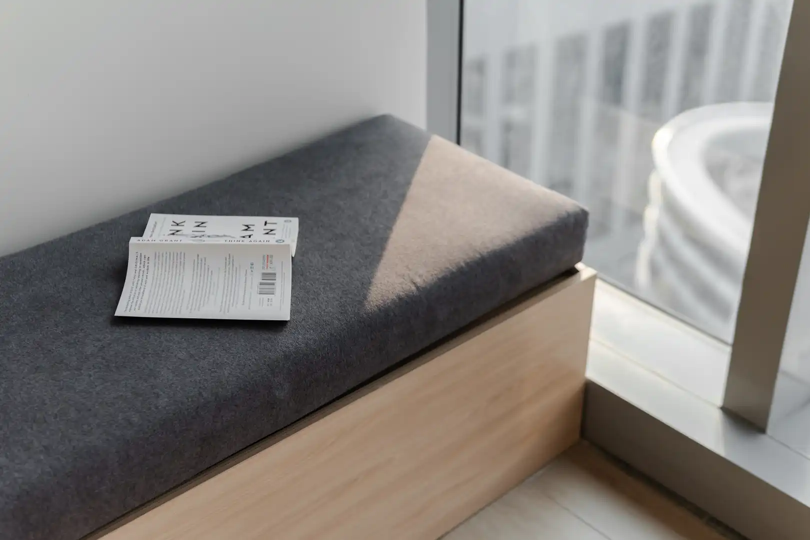 Bright dining area with wooden furniture and cherry blossom centerpiece