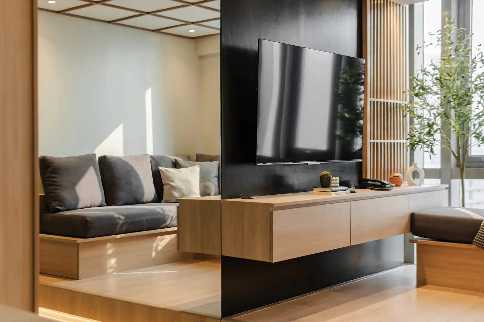 Bright dining area with wooden furniture and cherry blossom centerpiece